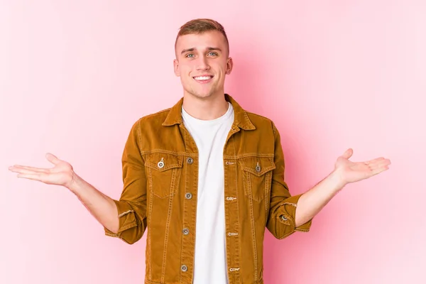 Young Caucasian Man Isolated Makes Scale Arms Feels Happy Confident — 스톡 사진