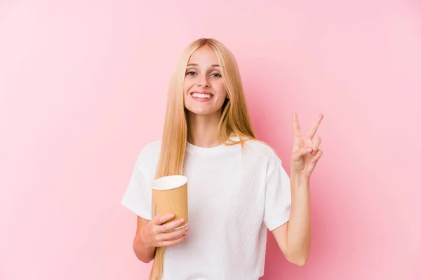 Young Blonde Girl Holding Takeaway Coffee Showing Number Two Fingers — 스톡 사진