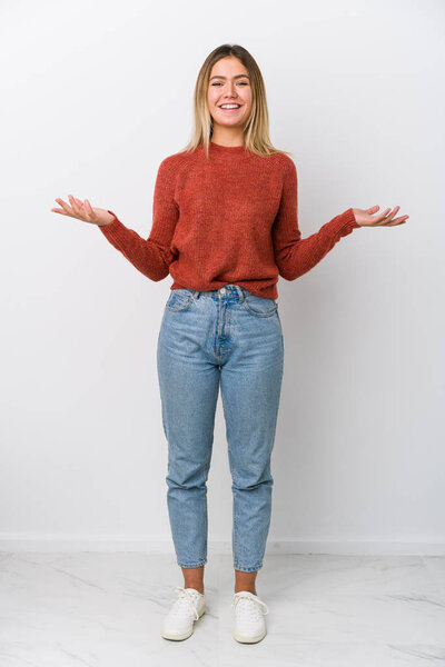 Full body young caucasian woman showing a welcome expression.