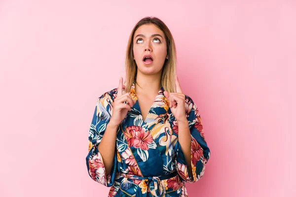 Young Caucasian Woman Wearing Pajamas Pointing Upside Opened Mouth — ストック写真