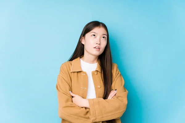 Young Chinese Woman Posing Blue Background Isolated Tired Repetitive Task — 스톡 사진