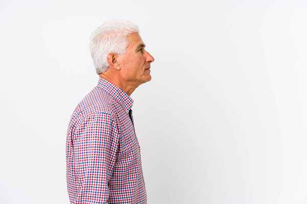 Senior caucasian man isolated gazing left, sideways pose.