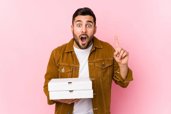 Young Handsome Man Holding Pizzas Isolated Having Idea Inspiration Concept — 스톡 사진