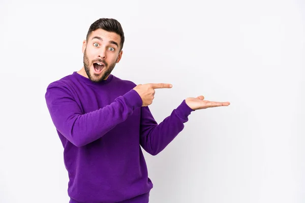 Young Caucasian Man White Background Isolated Excited Holding Copy Space — Stock Photo, Image