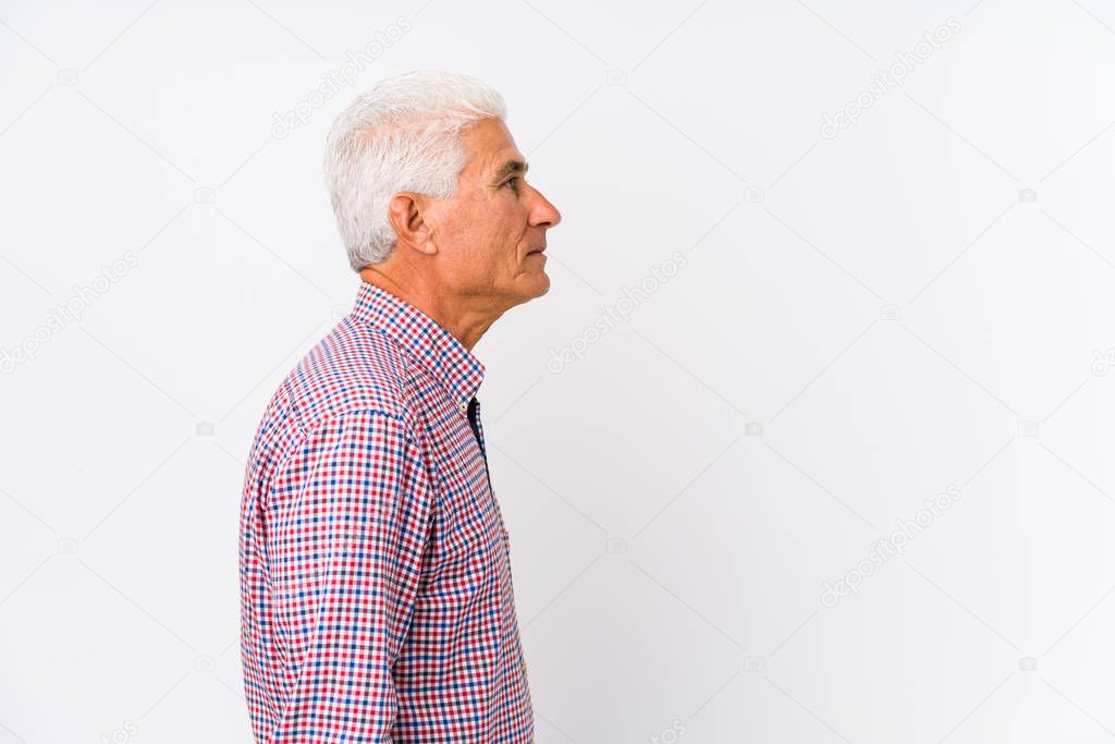 Senior caucasian man isolated gazing left, sideways pose.