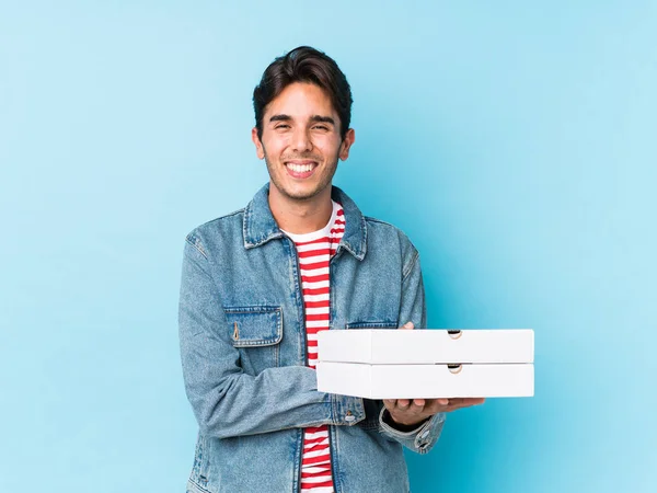 Young Caucasian Man Holding Pizzas Isolated Laughing Having Fun — 스톡 사진