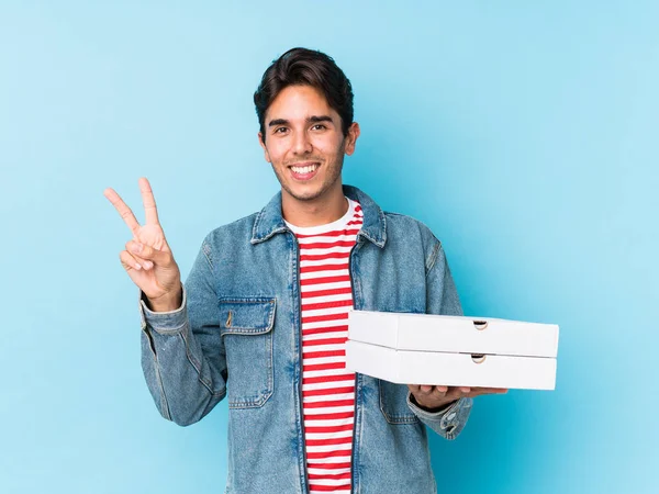 Young Caucasian Man Holding Pizzas Isolated Joyful Carefree Showing Peace — 스톡 사진