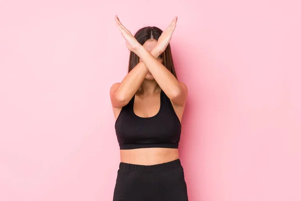 Young Fitness Caucasian Woman Isolated Keeping Two Arms Crossed Denial — Stock Photo, Image