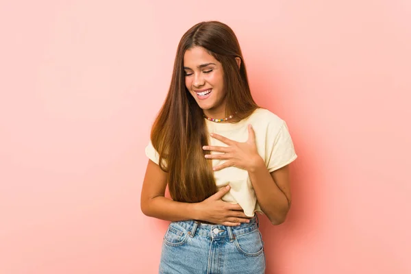 Young Slim Woman Laughs Happily Has Fun Keeping Hands Stomach — Stockfoto