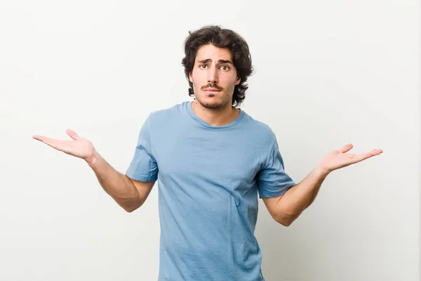 Young Handsome Man White Background Confused Doubtful Shrugging Shoulders Hold — Stock Photo, Image