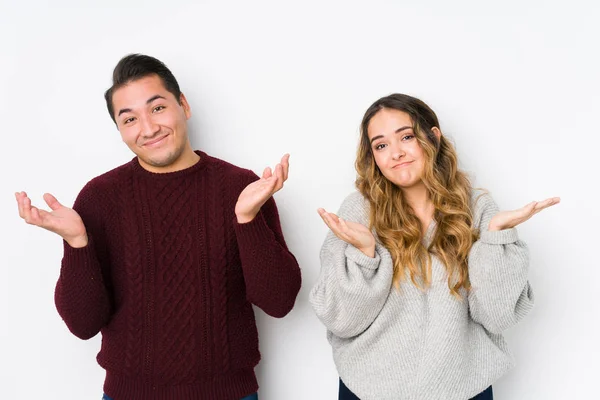 Young Couple Posing White Background Doubting Shrugging Shoulders Questioning Gesture — 스톡 사진