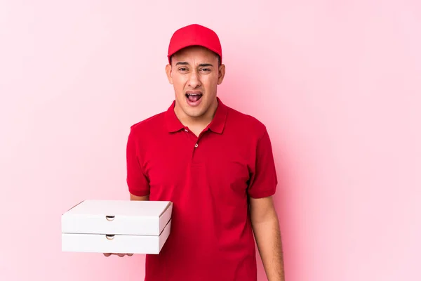 Young Pizza Delivery Latin Man Isolated Screaming Very Angry Aggressive — ストック写真