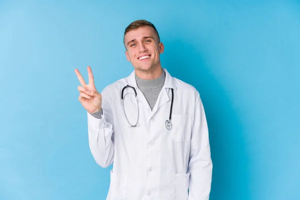 Young Caucasian Doctor Man Joyful Carefree Showing Peace Symbol Fingers — 스톡 사진