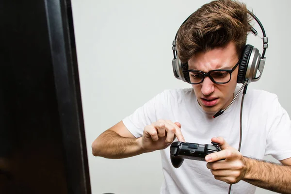 Teenager caucasian man playing computer games