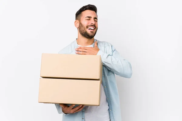 Young Caucasian Man Moving New Home Isolated Laughs Out Loudly — Stock Photo, Image