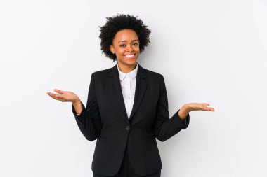 Middle aged african american business  woman against a white background isolated showing a welcome expression.