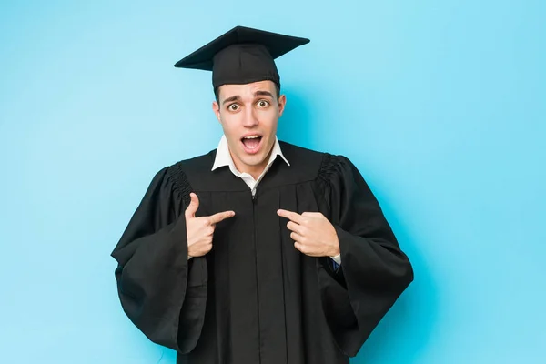 Young Caucasian Graduated Man Surprised Pointing Himself Smiling Broadly — Stock Photo, Image