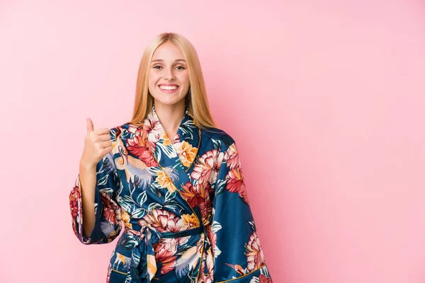 Young Blonde Woman Wearing Kimono Pajama Smiling Raising Thumb — 스톡 사진