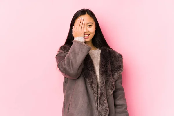 Young Chinese Woman Wearing Coat Isolated Having Fun Covering Half — 스톡 사진