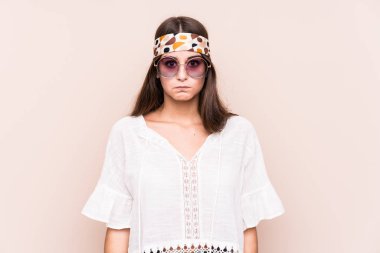 Young hipter caucasian woman isolated shrugs shoulders and open eyes confused.