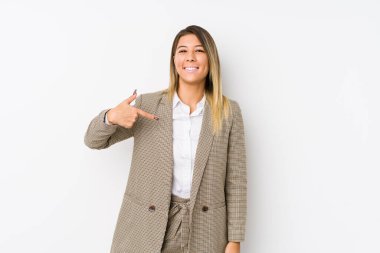 Young caucasian business woman isolated person pointing by hand to a shirt copy space, proud and confident