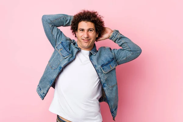 Curly Mature Man Wearing Denim Jacket Pink Background Stretching Arms — 스톡 사진