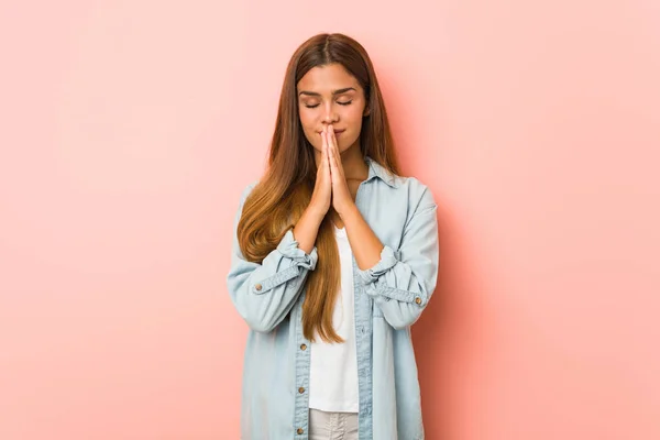 Young Slim Woman Holding Hands Pray Mouth Feels Confident — Stockfoto