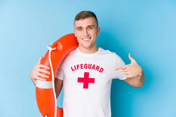 Young Lifeguard Man Holding Rescue Float Person Pointing Hand Shirt — 스톡 사진