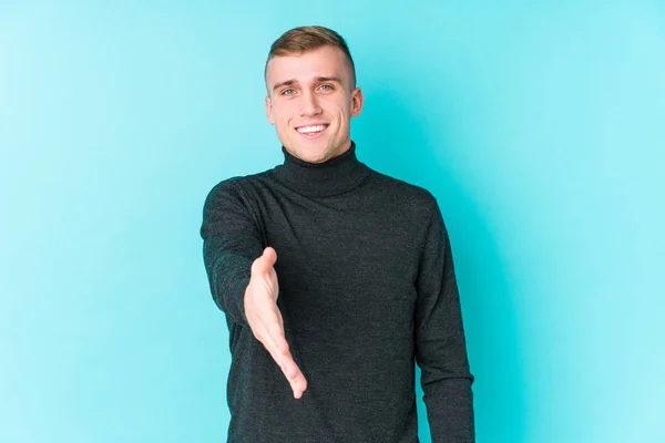 Young Caucasian Man Blue Background Stretching Hand Camera Greeting Gesture — 스톡 사진