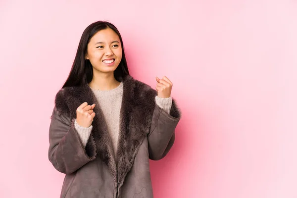 Young Chinese Woman Wearing Coat Isolated Raising Fist Victory Winner — 스톡 사진