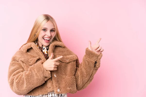 Young Blonde Woman Wearing Coat Pink Background Pointing Forefingers Copy — 스톡 사진