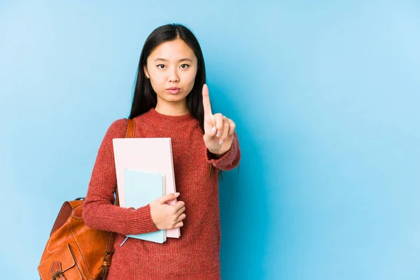 Νεαρή Κινέζα Μαθήτρια Απομονωμένη Δείχνοντας Νούμερο Ένα Δάχτυλο — Φωτογραφία Αρχείου