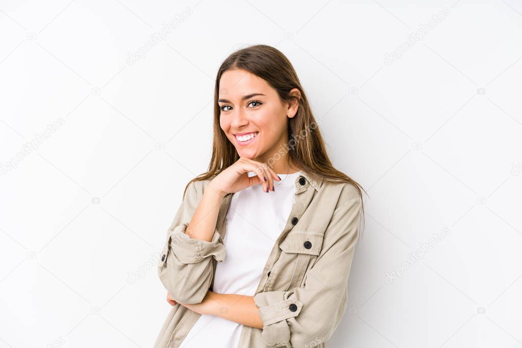 Young caucasian woman  isolated smiling happy and confident, touching chin with hand.