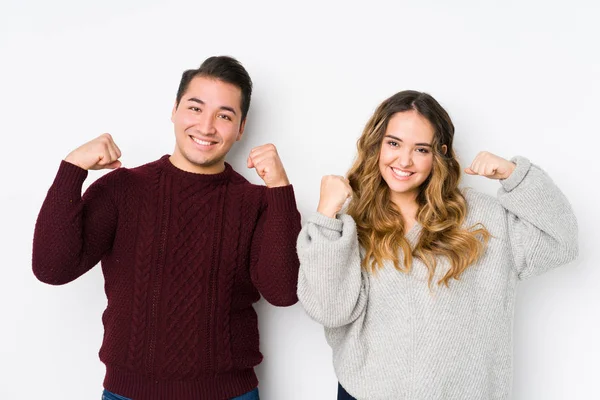 Young Couple Posing White Background Showing Strength Gesture Arms Symbol — 스톡 사진