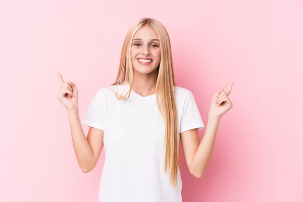 Young Blonde Woman Pink Background Indicates Both Fore Fingers Showing — Stock Photo, Image