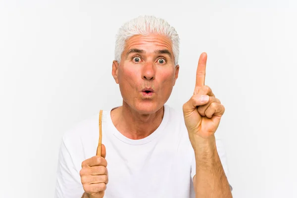 Senior Caucasian Man Holding Teethbrush Isolated Having Some Great Idea — Stock Photo, Image