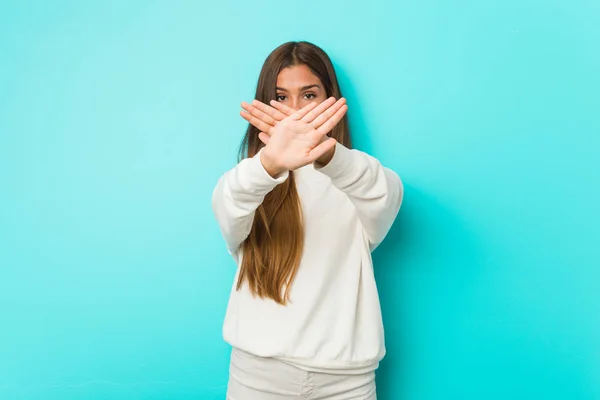 Young slim woman doing a denial gesture