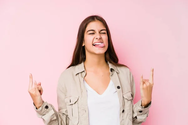 Young Caucasian Woman Posing Pink Background Showing Rock Gesture Fingers — Stock Photo, Image