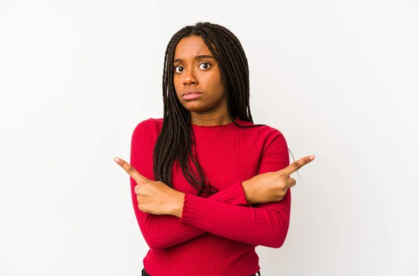 Young African American Woman Isolated Points Sideways Trying Choose Two — Stock Photo, Image