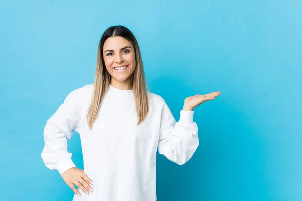 Young Caucasian Woman Isolated Showing Copy Space Palm Holding Another — 스톡 사진