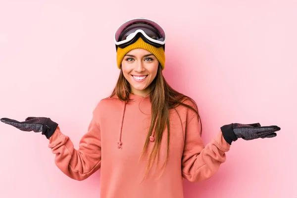 Young Caucasian Woman Wearing Ski Clothes Isolated Makes Scale Arms — 스톡 사진