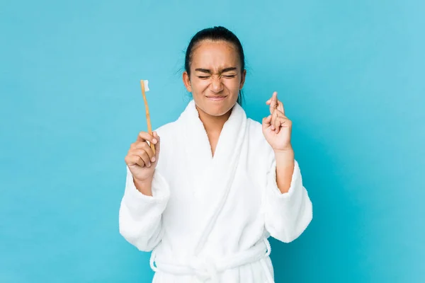 Young Mixed Race Indian Holding Toothbrush Crossing Fingers Having Luck — 스톡 사진