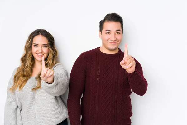 Young Couple Posing White Background Showing Number One Finger — Stok fotoğraf