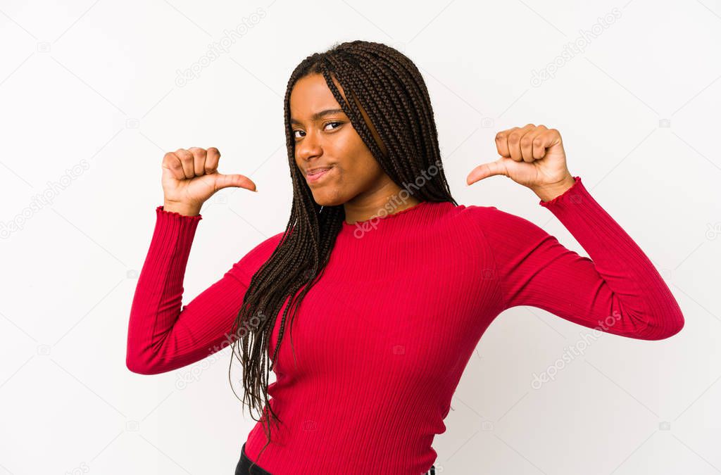 Young african american woman isolated feels proud and self confident, example to follow.