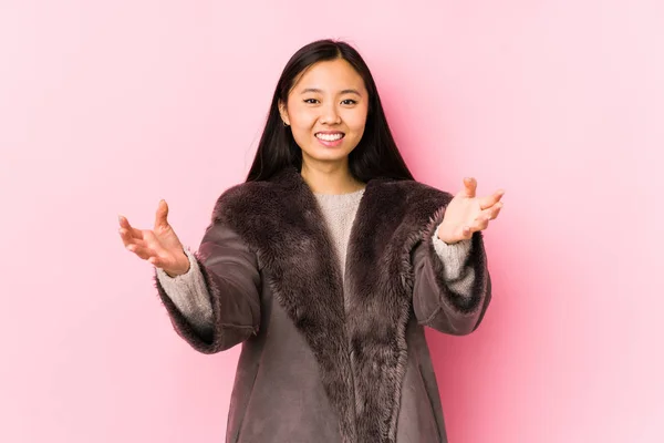 Young Chinese Woman Wearing Coat Isolated Feels Confident Giving Hug — 스톡 사진