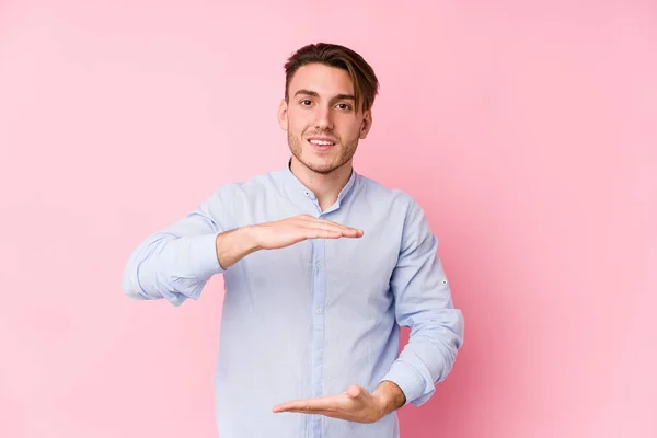 Young Caucasian Man Posing Pink Background Isolated Holding Something Both — Stock Photo, Image