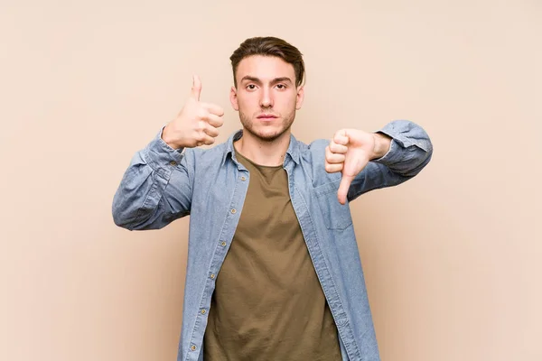 Young Caucasian Man Posing Isolated Showing Thumbs Thumbs Difficult Choose — 图库照片