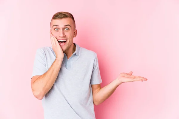 Young Caucasian Man Isolated Holds Copy Space Palm Keep Hand — Stock Photo, Image