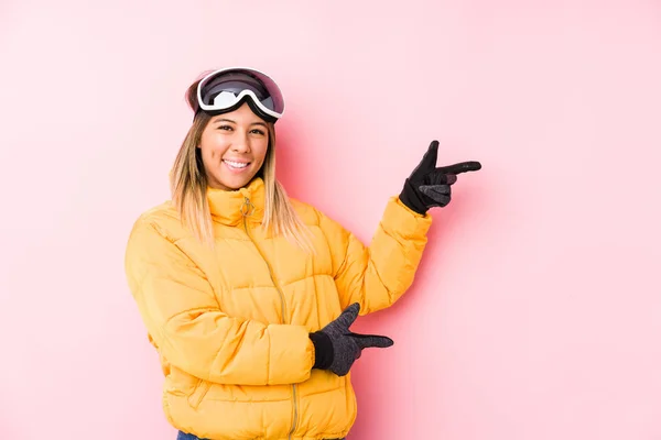 Young Caucasian Woman Wearing Ski Clothes Pink Background Excited Pointing — 스톡 사진