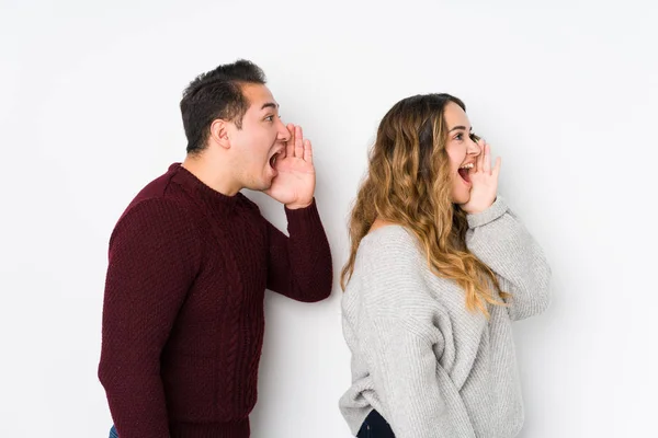 Young Couple Posing White Background Shouting Holding Palm Opened Mouth — 스톡 사진